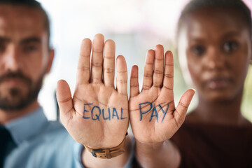 Hands, equality and empowerment with a business man and woman showing an equal pay notice in their palms. Team, community and collaboration with male and female colleagues standing together in unity - obrazy, fototapety, plakaty