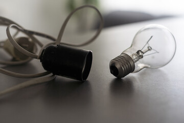 Lamp socket in black color for lamp bulb lamp on gray background, lamp holder, electrical cartridge...