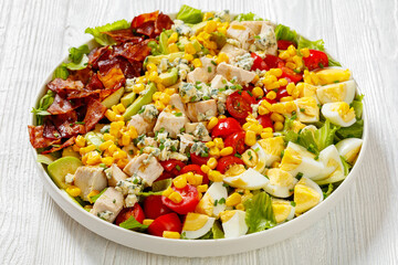 American garden salad on plate, top view