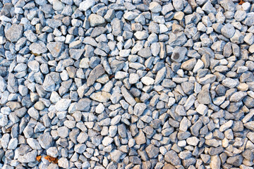 small stone background, light gravel road pebbles stone texture. Abstract background with farden...