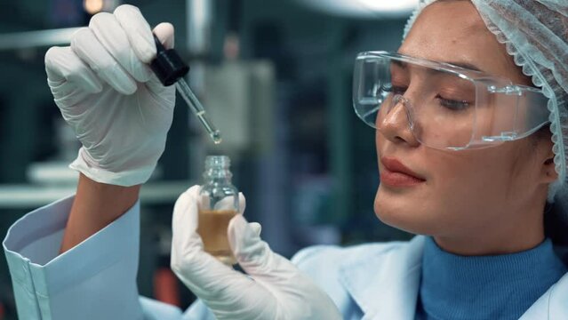 Scientist test CBD hemp oil product in curative CBD lab . The hemp oil contain natural cbd extraction from organic hemp in the farm .