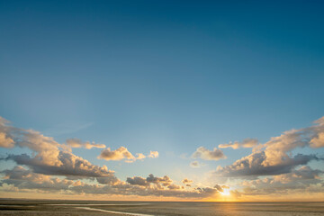 Sunset and clouds at the beach