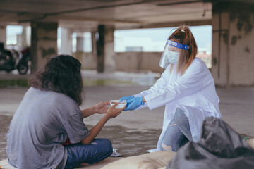 Health workers provide assistance to the homeless. homeless poor people and depression concepts.