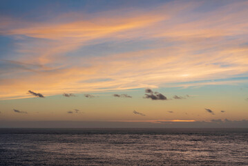 Fototapeta na wymiar Stunning sunset sky landscape colorful vibrant over ocean