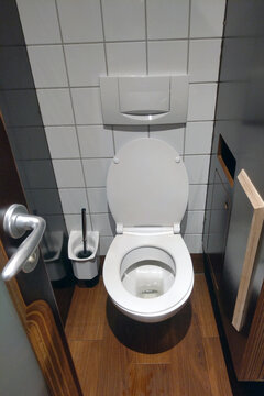 Clean and modern toilet cubicle in a cafe or restaurant.