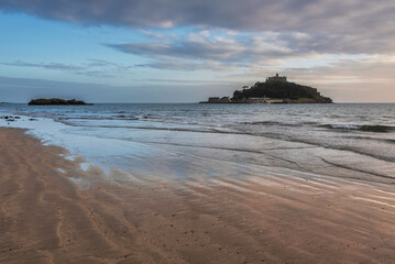 Lovely landscape image of St Michael's Mount in Cornwall England during soft pastel color sunset evening