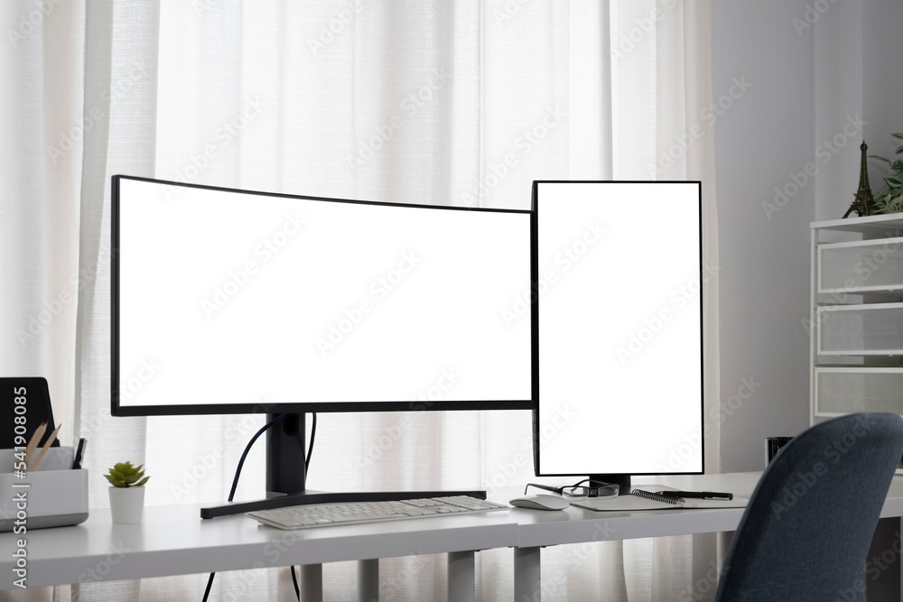 Aufkleber workspace with curved-screen computer design and vertical monitor on the office desk.
