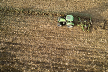 Aerial view of a tractor at the time of winter soil preparation