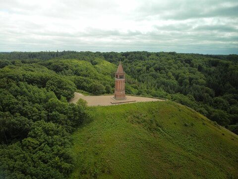 Highest sky mountain top with tower surrounded by thick forest in Denmark