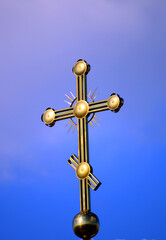 Fototapeta na wymiar church cross of the Greek Catholic Church against the sky 