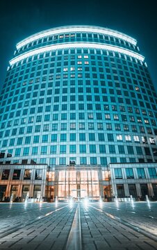 Facade Of High Business Center Building With Bright Neon Blue Lights, Irvine, USA, Low Angle