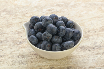 Sweet ripe blueberry heap in the bowl