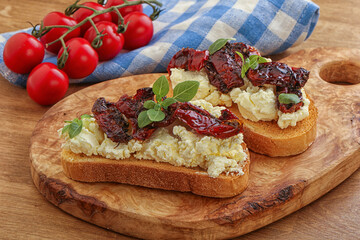 Bruschetta with soft cheese and tomato