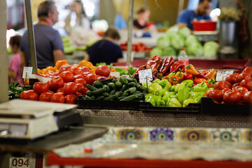 Shallow depth of field (selective focus) details with vegetables stand in Obor market in Bucharest,...