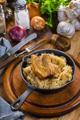 Traditional spare ribs baked in sauerkraut.