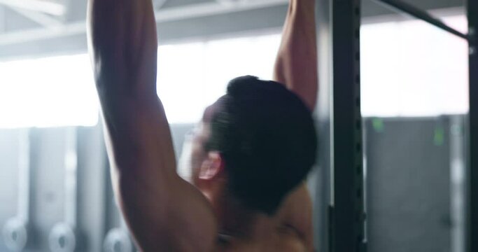 Pull up, fitness and strong man training in the gym for body goal, motivation and workout. Wellness, exercise and bodybuilder athlete with energy, power and muscle for cardio sports at a club