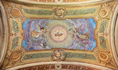 IVREA, ITALY - JULY 15, 2022: The ceiling fresco of Lamb of God among the angels in the church...