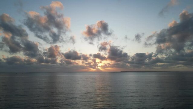 Indian Ocean panorama near Uroa beach coast in Zanzibar Island during sunset, Tanzania Africa, Aerial dolly out shot