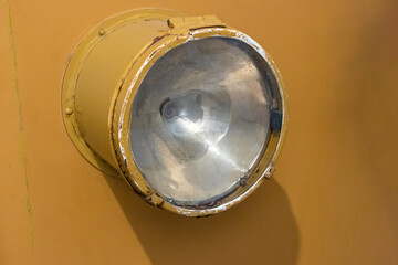 The headlight of a historic tram