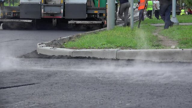 Road rollers are compaction new asphalt pavement.