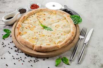 Fresh hot cheese pizza on the concrete background
