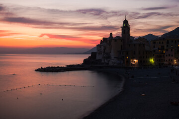 Spectacular sky during blue hour with the Basilica of Santa Maria Assunta in Camogli, Italy.