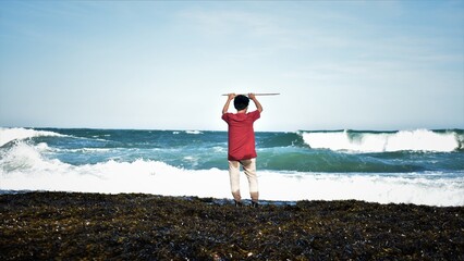 Photo of people in the seaweed beach