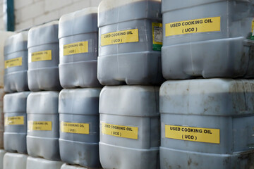 stock of used cooking oil in jerry cans.  used cooking oil collectors to reduce environmental...