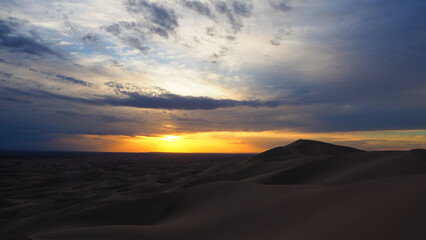 Fototapeta na wymiar Sunset sky over Gobi desert dunes in Mongolia