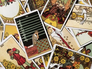 Picture of the Nine of Swords tarot card from the original Rider Waite tarot deck with mixed tarot...