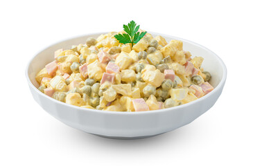 The traditional olivier salad with vegetables and fresh herbs is isolated on a white background. Side view, close-up.
