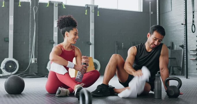 High five, fitness and happy man and women water drink after training workout in gym together. Healthy sports coach, exercise motivation partnership goal success and target team hydrate on floor - Powered by Adobe