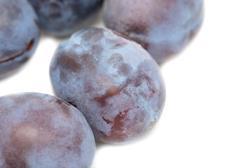 Ripe plum berries isolated on white background.