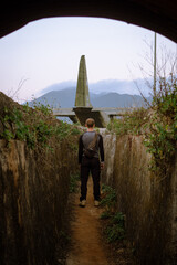 The man in the trenches looking at the plane in Vietnam
