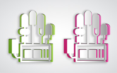 Paper cut Mechanical robot hand icon isolated on grey background. Robotic arm symbol. Technological concept. Paper art style. Vector