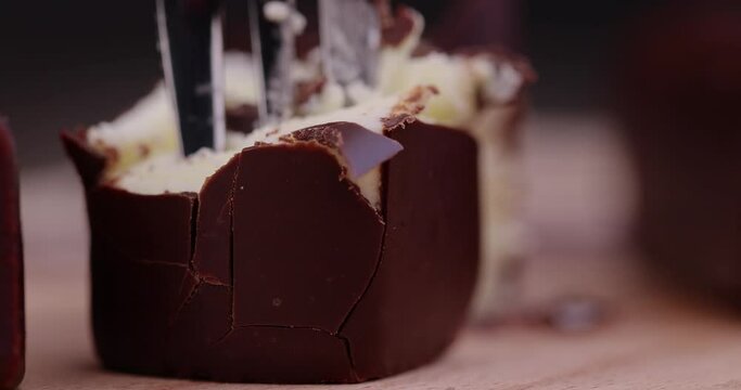 Take a fork of sweet curd cheese made from milk with milk chocolate, a sweet dessert made from dairy products and chocolate
