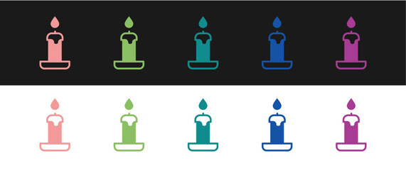 Set Burning candle in candlestick icon isolated on black and white background. Cylindrical candle stick with burning flame. Vector