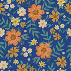 Cute floral pattern in a small flower. Seamless vector texture. An elegant template for fashionable prints. Print with orange and brown flowers, green leaves. blue background.