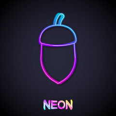 Glowing neon line Acorn icon isolated on black background. Vector
