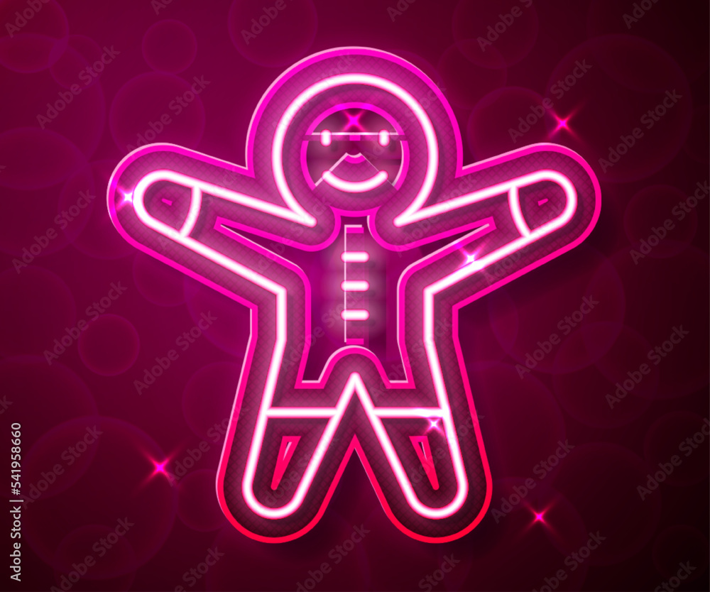 Poster glowing neon line holiday gingerbread man cookie icon isolated on red background. cookie in shape of