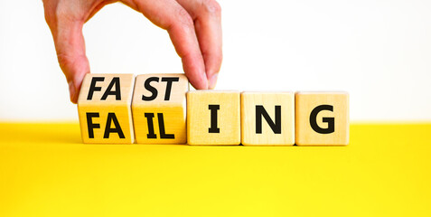 Fasting or failing symbol. Concept words Fasting or Failing on wooden cubes. Businessman hand....