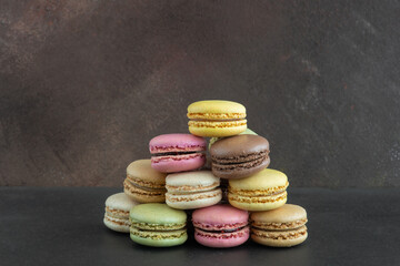 stack of colorful macaroons, close up and variety of flavors