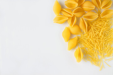 two types of pasta on a white background, copy space, supermarket products