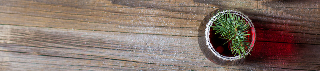 banner of Cranberry red drink decorated with fir tree branches berry and sugar. Christmas hot...