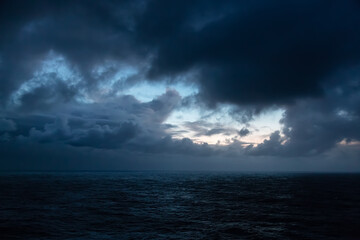 Dramatic Colorful Sunrise Sky over North Atlantic Ocean. Cloudscape Nature Background.