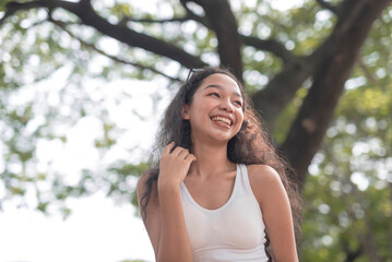A stolen picture of a happy young lady with beautiful curly hair.