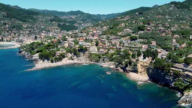 Aerial push towards Camogli, Italy with beautiful blue sea and amazing architecture.
