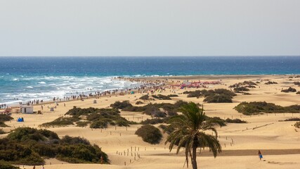 Mass tourism at the beach of Playa del Ingles in Gran Canaria