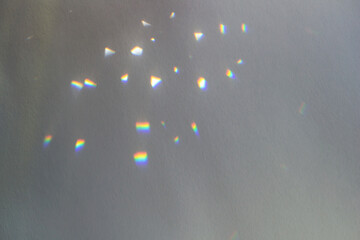 Rainbow light crystal leak overlay background. Prism glass flare effect texture. Sunlight rays,...