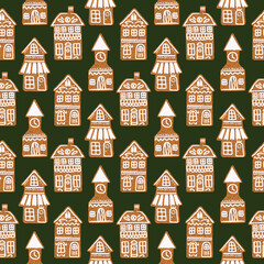 Seamless christmas pattern with gingerbread cookies on a green background.